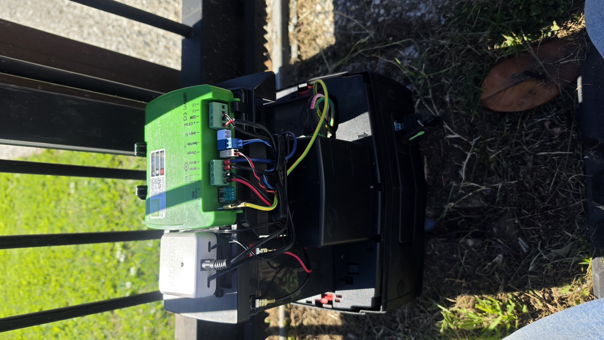 Gate motor wiring and installation in progress